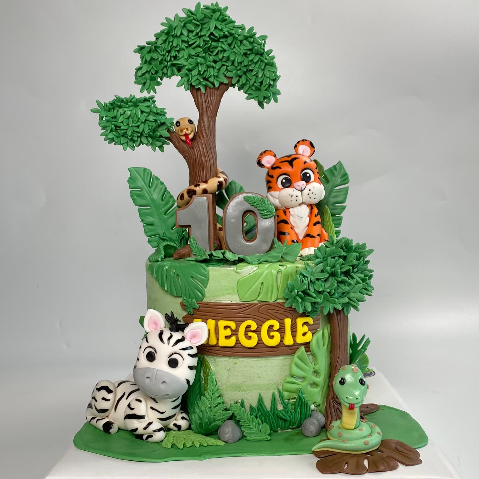 100% edible fondant sculpted safai scene with tiger and zebra