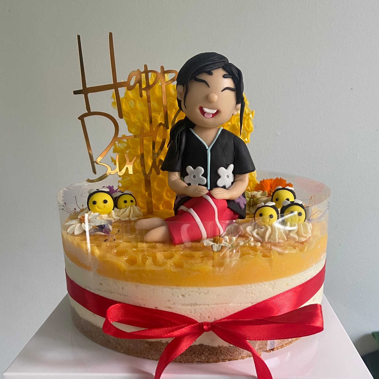 100% edible fondant sculpted custom girl character on cheesecake