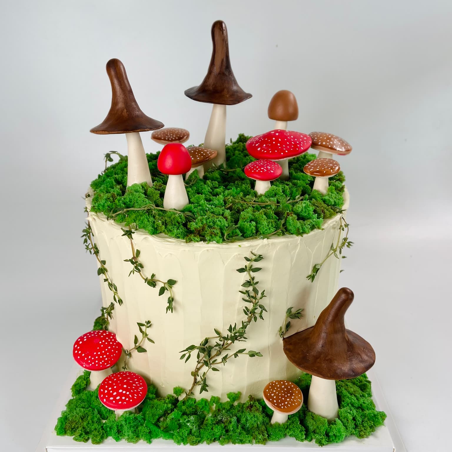 100% edible fondant sculpted mushrooms surrounded by moss cake
