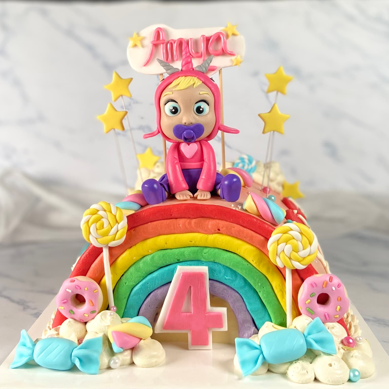 100% edible fondant sculpted rainbow themed cake