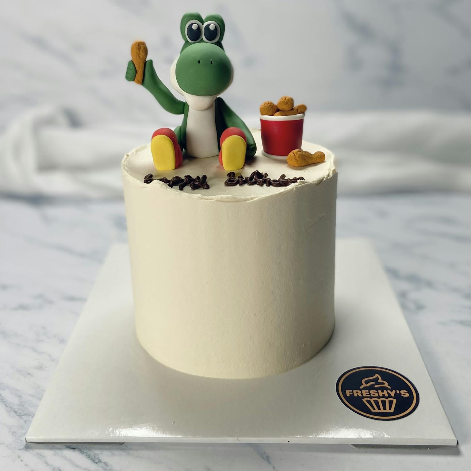 100% edible fondant sculpted Yoshi and chicken cake