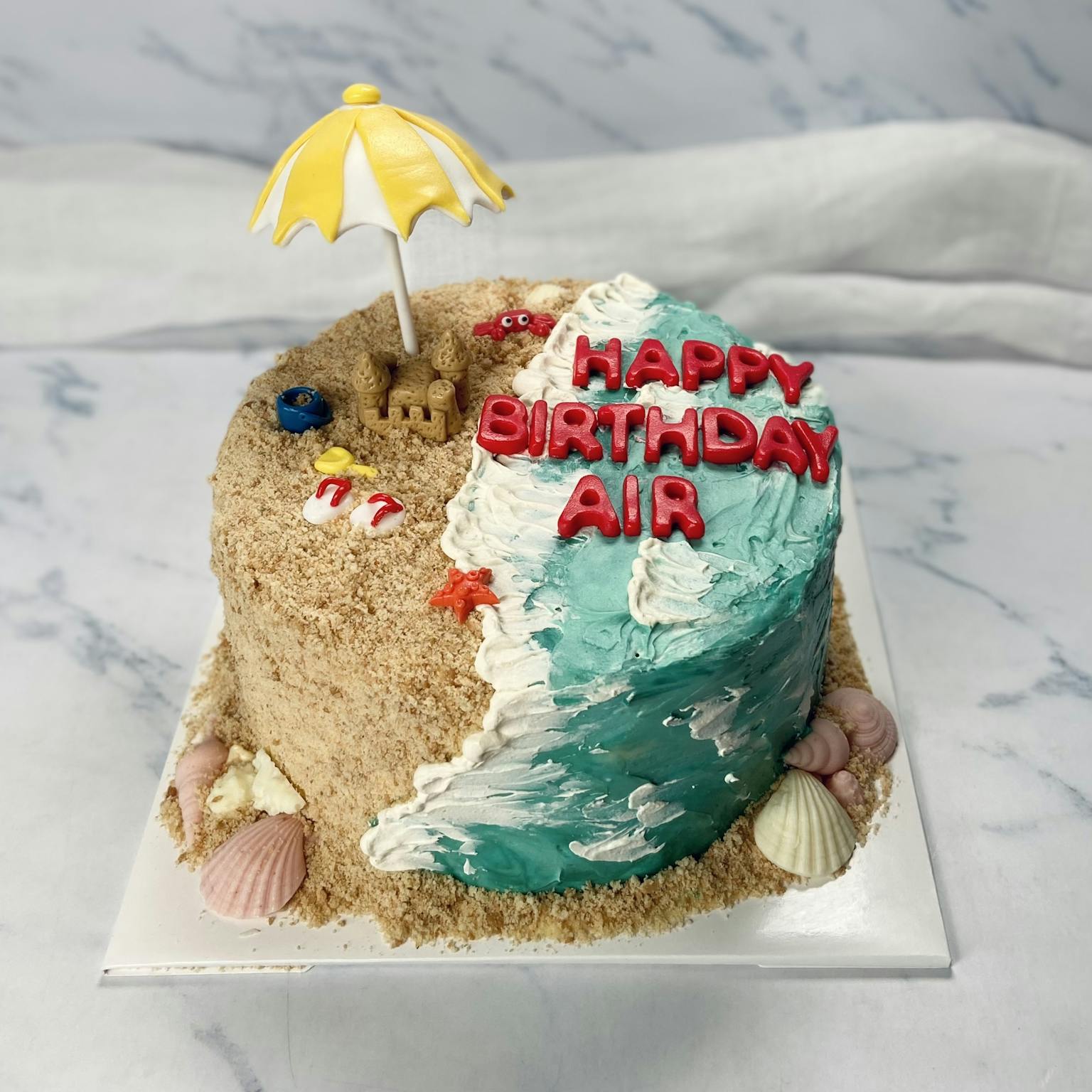 100% edible fondant sculpted beach themed cake