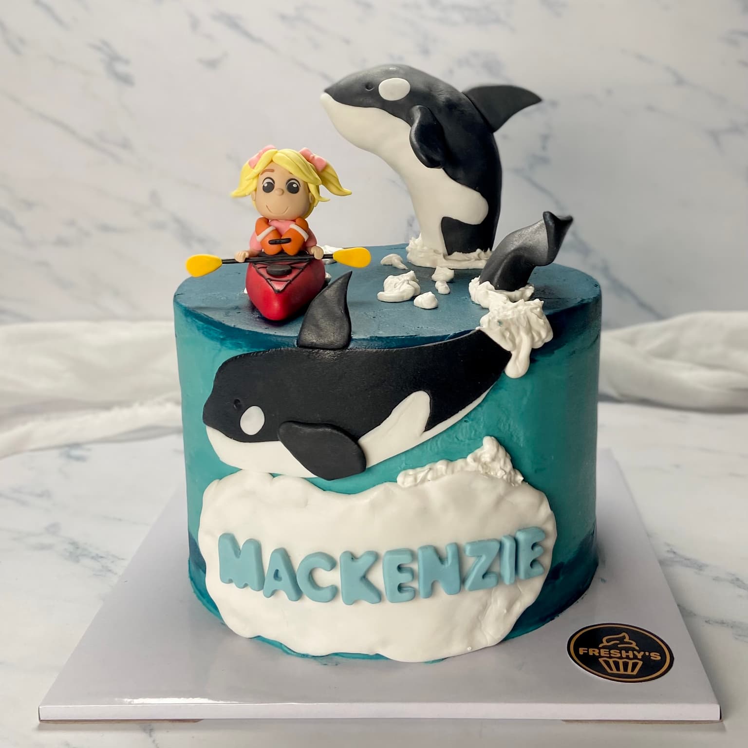 100% edible fondant sculpted kayak and killer whale cake